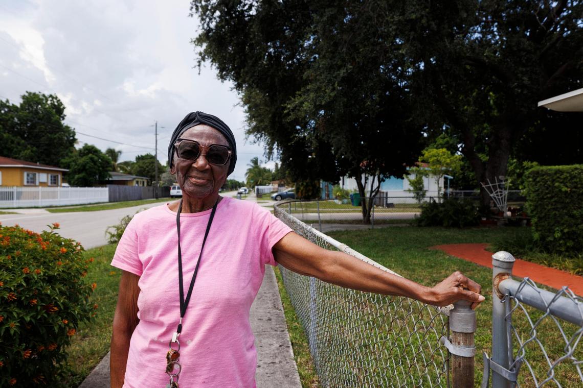 Mary Bennett, founding president of the Gratigny Homeowners Association, poses outside her home in the Gratigny neighborhood in Miami, Fla.