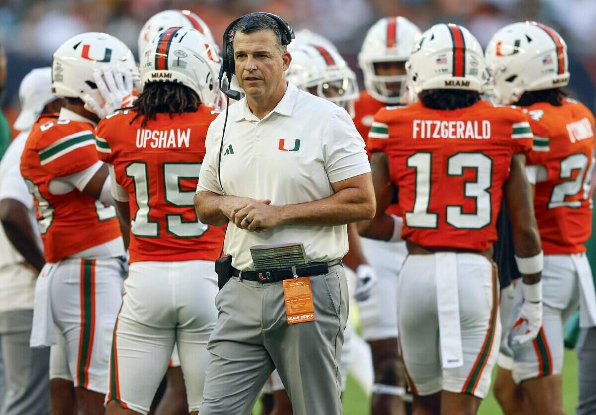 Miami Hurricanes head coach Mario Cristobal on the field during a time out of an NCAA football game against the Syracuse Orange at Hard Rock Stadium in Miami Gardens, Florida on Saturday, November 8, 2025.