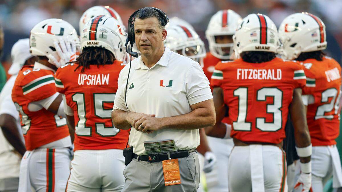 Miami Hurricanes head coach Mario Cristobal on the field during a time out of an NCAA football game against the Syracuse Orange at Hard Rock Stadium in Miami Gardens, Florida on Saturday, November 8, 2025. 