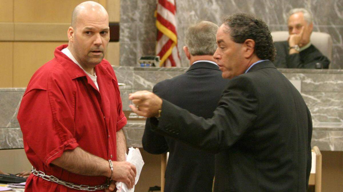 Cuffed and shackled, convicted murderer Howard Steven Ault enters the courtroom and has a word with his court-appointed attorney Mitchell Polay on July 30, 2007, just before jury selection in the death penalty phase of his trial for killing two young girls back in 1996.