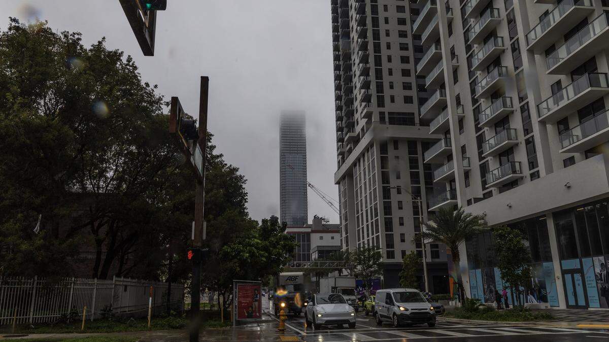 Low clouds covered the top of Miami skyline buildings during a cloudy morning.