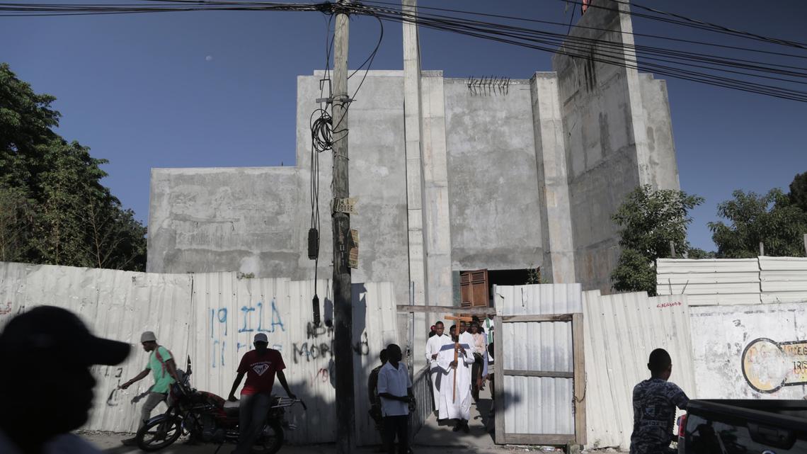 Altar boys file out of an unfinished St. Louis Roi de France Catholic Church on Nov. 17 in Port-au-Prince’s Turgeau neighborhood.