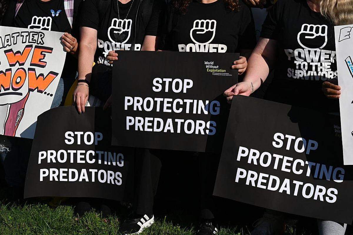 People demostrate during the Stand with Survivors Rally in support of Jeffrey Epstein and Ghislaine Maxwell's victims, in Washington, DC on September 3, 2025. (Photo by ROBERTO SCHMIDT/AFP via Getty Images)