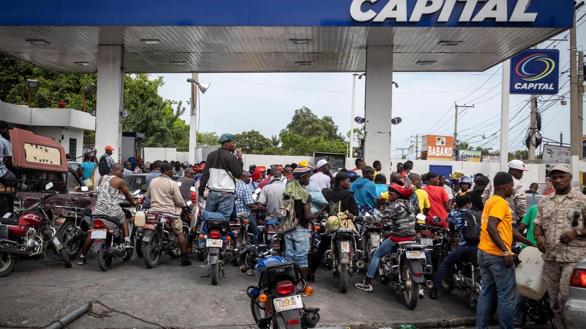 In this file photo, Haitians wait to get fuel at a gas station in Port-au-Prince, Haiti, on Tuesday, June 21, 2022. The fuel shortage had became a recurring problem and oil companies in May 2025 are warning it could return due to gangs’ increased tolls and violence.