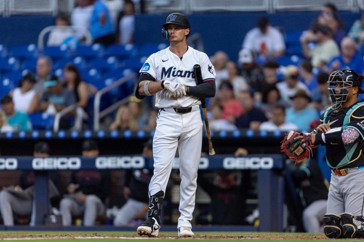 Miami Marlins outfielder Griffin Conine (18) adjusts his gloves during the second inning of an MLB game against the Arizona Diamondbacks at loanDepot park on Wednesday, April 16, 2025, in Miami, Fla.