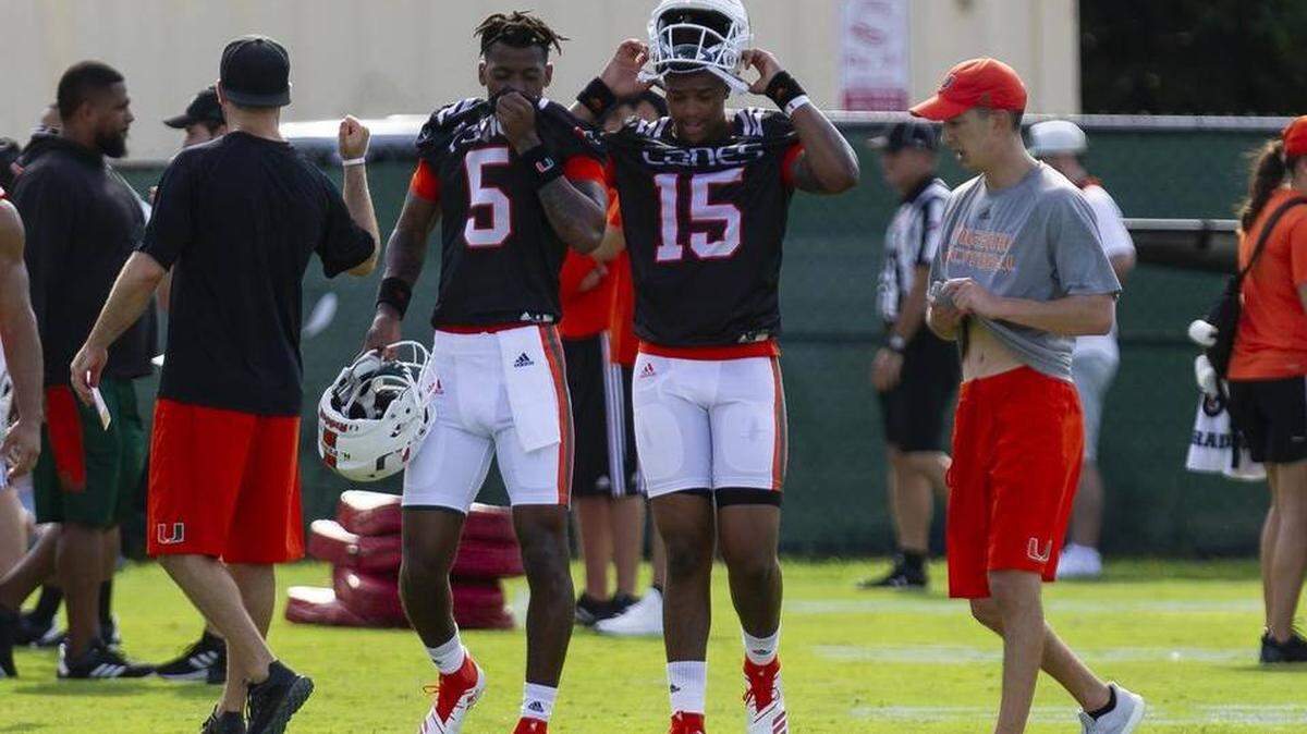 Quarterbacks N’Kosi Perry (left) and Jarren Williams are shown at University of Miami 2018 fall camp in early August.