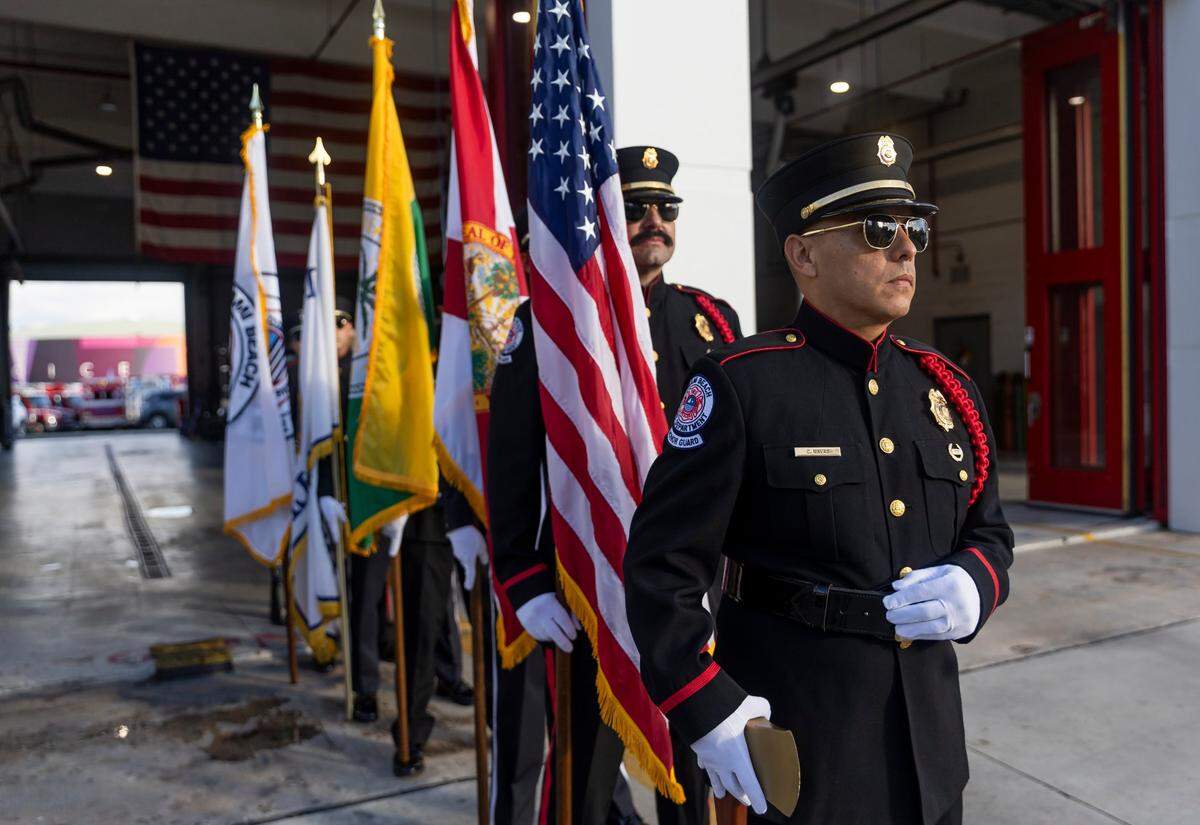 Claudio Navas, a Miami Beach Fire Department Fire Investigator and a member of the Honor Guard, far-right, attends a September 11, 2001, remembrance ceremony at Fire Station 2 on Monday, Sept. 11, 2023, in Miami Beach, Fla.