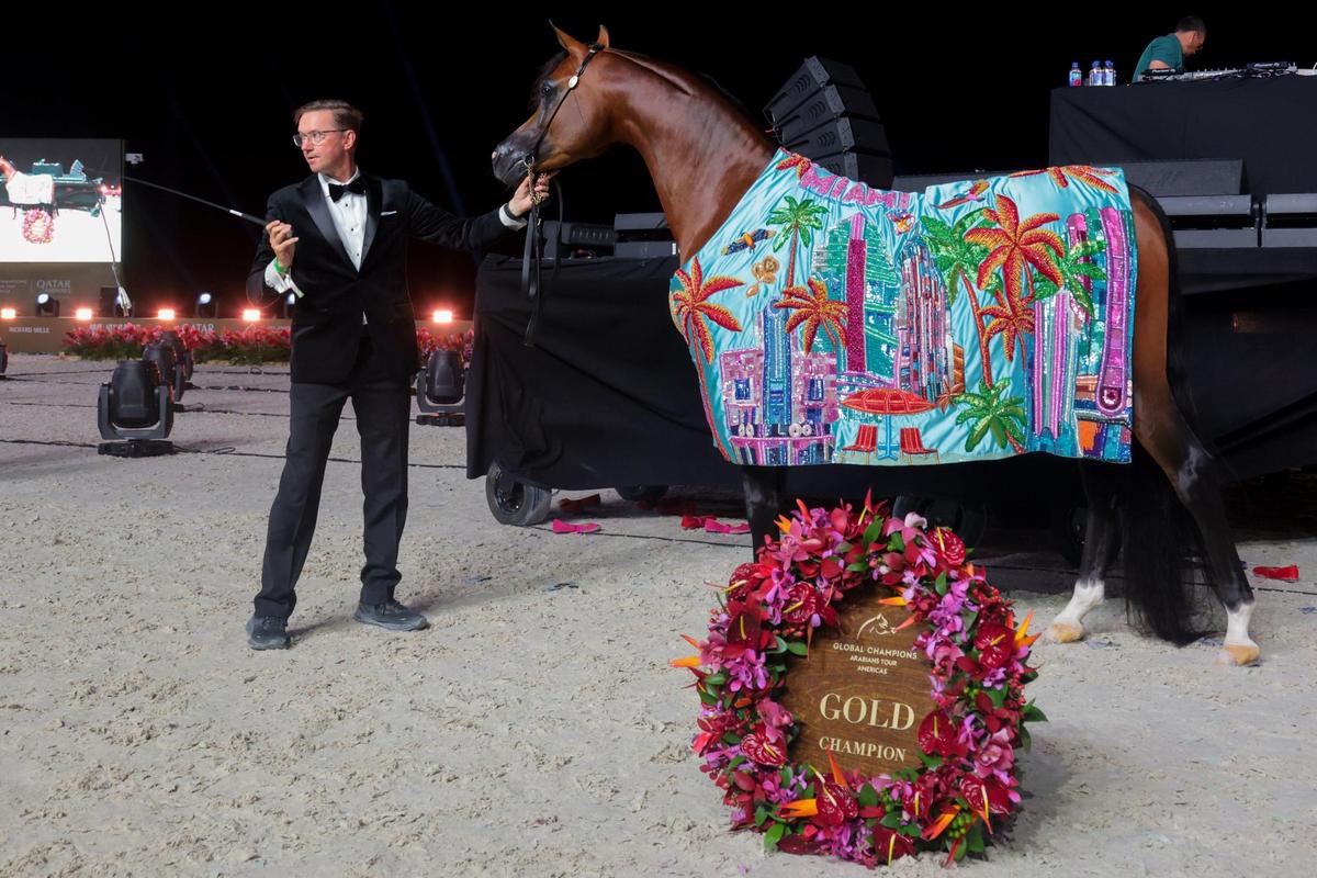 Handler Andy Sellman poses with Tasheem PMA after winning the Senior Stallions Championship event at the Global Champions Arabians Tour Miami Beach.
