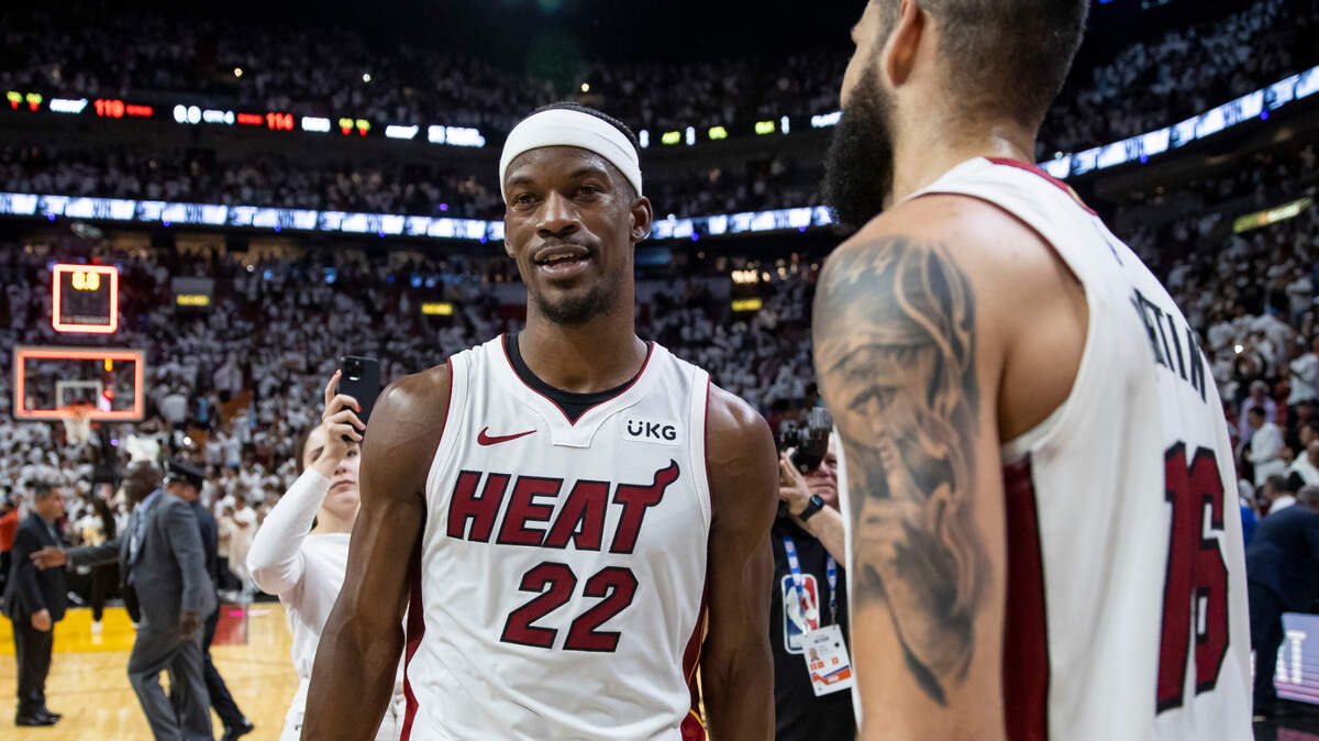 Miami Heat forwards Jimmy Butler (22) and Caleb Martin (16) celebrate after defeating the Milwaukee Bucks during Game 4 of the first-round NBA basketball playoff series at the Kaseya Center on Monday, April 24, 2023, in downtown Miami, Fla.