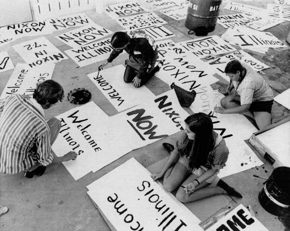 Young volunteers paint placards to be displayed at the Miami airport welcoming delegations from around the country as they arrive to attend the Republican National Convention in Miami Beach in 1972.