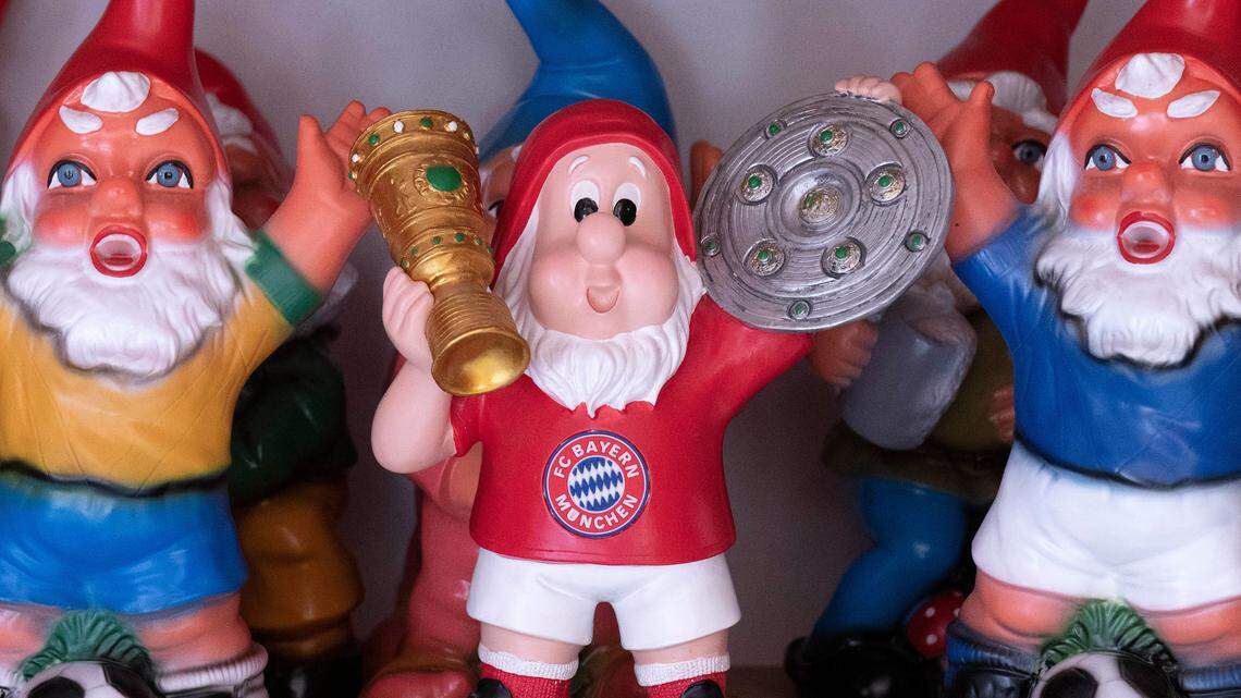 A Bayern Munich soccer dwarf figure, center, stands in a showroom of Germany’s Garden Gnom Park (Zwergen-Park) in Trusetal, Germany, Sunday, April 22, 2018. Every year up to 100,000 tourists visit the Garden Gnome Theme Park with more than 2,500 garden gnomes. (AP Photo/Jens Meyer)