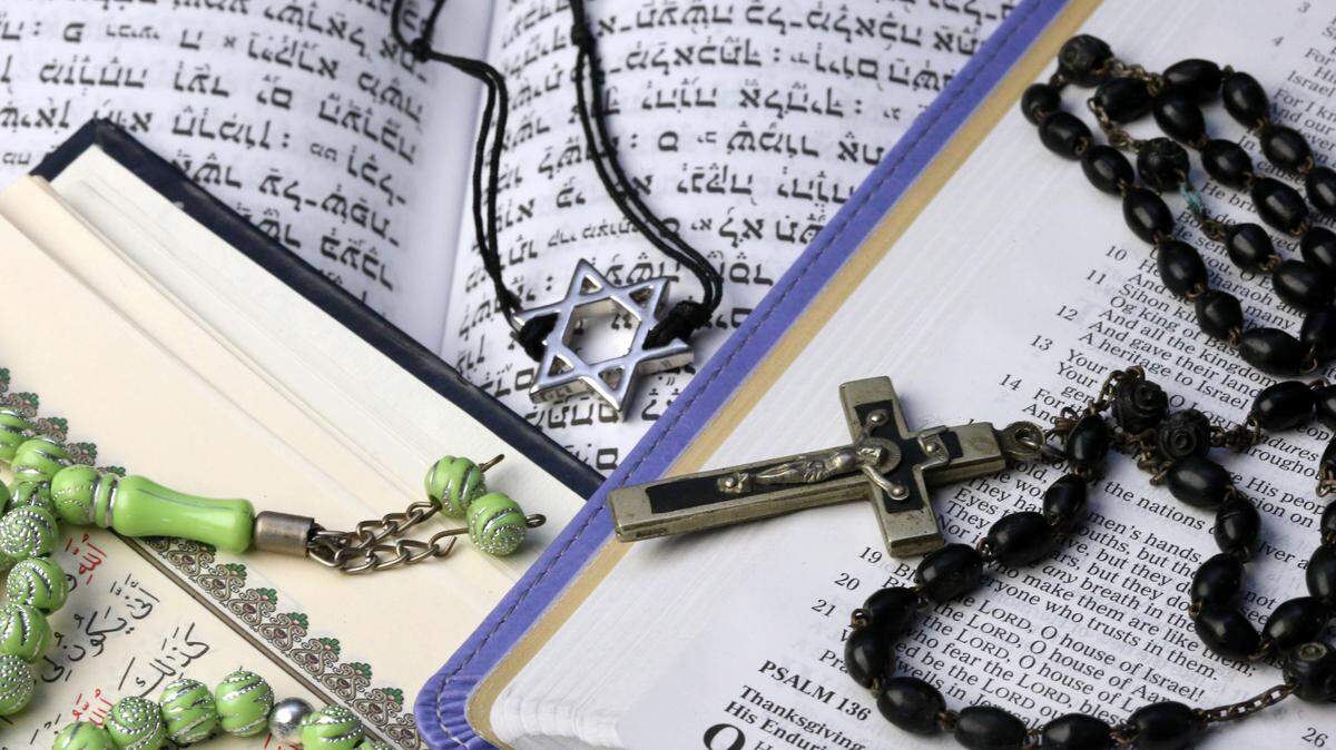 Religious books and symbols are shown in this file photo.