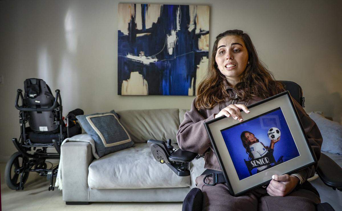 Katerina ‘Katy’ Puig holds her senior year portrait from Our Lady of Lourdes Academy at her home in Miami, FL, on Wednesday, Oct. 15, 2025. She was captain of the Lourdes soccer team when she was severely injured in the Sept. 4, 2022, boat crash in Biscayne Bay. The boat operator, George Pino, crashed his boat into a fixed channel marker at nearly 50 mph, causing the boat to capsize. Katy was found unconscious in the water and had to have emergency brain surgery at Nicklaus Children’s Hospital the night of the crash.
