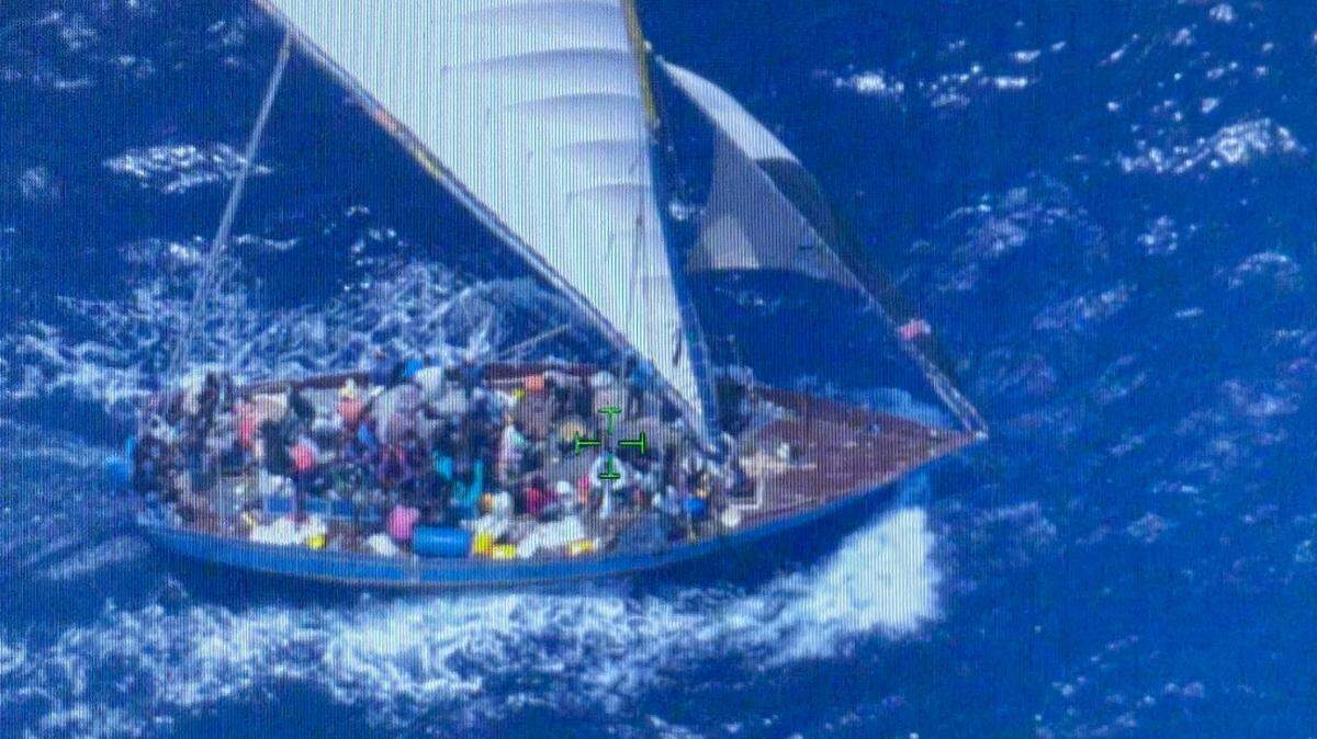 An overloaded sailboat packed with people migrating from Haiti is filmed by a U.S. Customs and Border Protection air crew about 45 miles off the Florida Keys Tuesday, May, 24, 2022.