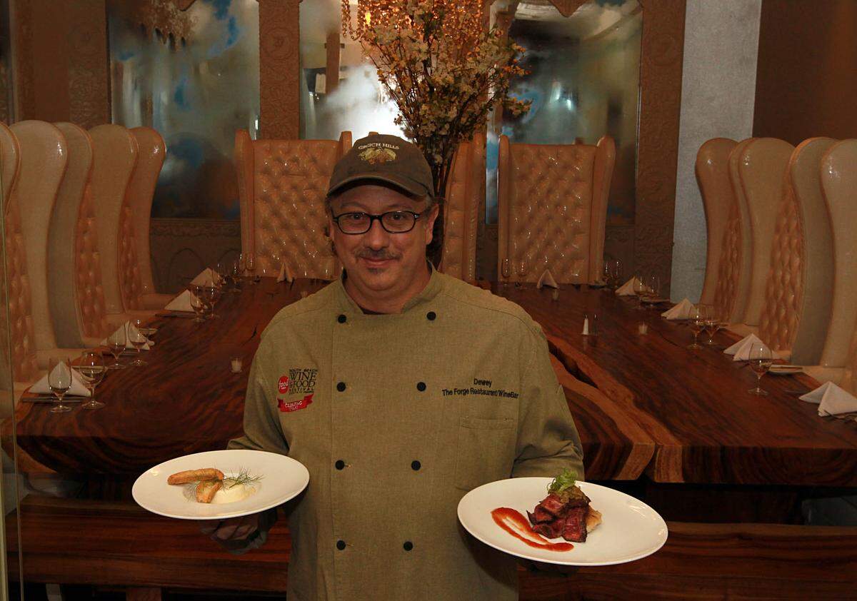 Chef Dewey LoSasso, displays a Fennel Lemon Panacotta, dessert and a grilled skirt steak leek chutney and tomato jam, two dishes from The Forge Restaurant’s menu for Miami Spice month. Wednesday August 10, 2011.