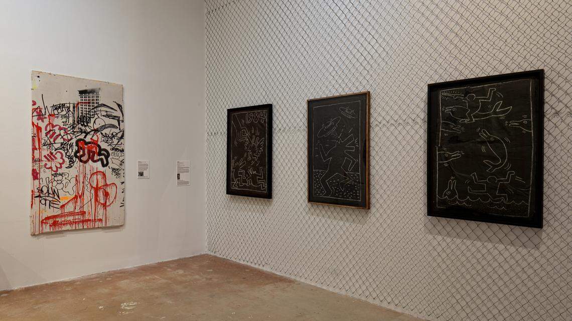 The show features Keith Haring’s famous chalk on paper drawings of dolphins, barking dogs and UFOs that he made in New York City’s subway system.