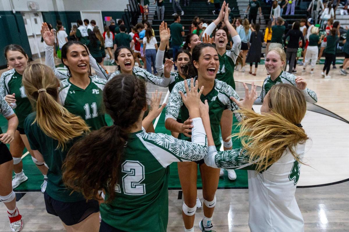 Pine Crest’s girls’ volleyball team reacts to defeating Cardinal Gibbons in four sets during the regional semifinal playoff volleyball match at Pine Crest School campus in Fort Lauderdale, Florida, on Thursday, October 26, 2023.