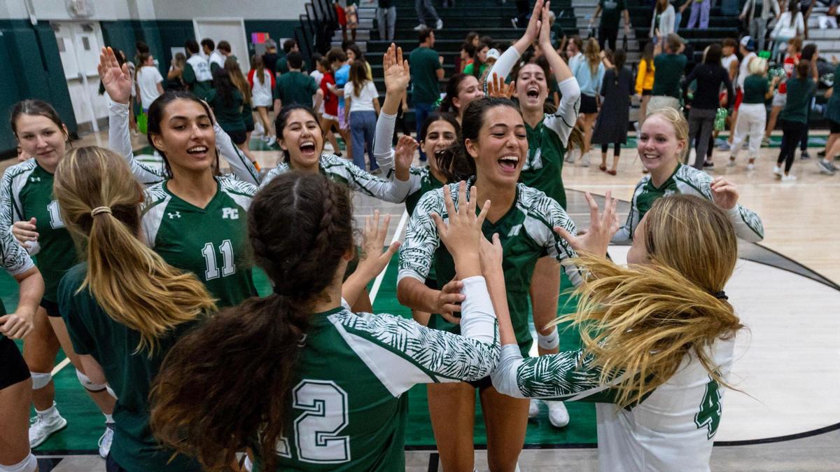 Pine Crest Girl’s volleyball team reacts to defeating Cardinal Gibbons in four sets during the regional semifinal playoff volleyball match at Pine Crest School campus in Fort Lauderdale, Florida, on Thursday, October 26, 2023.