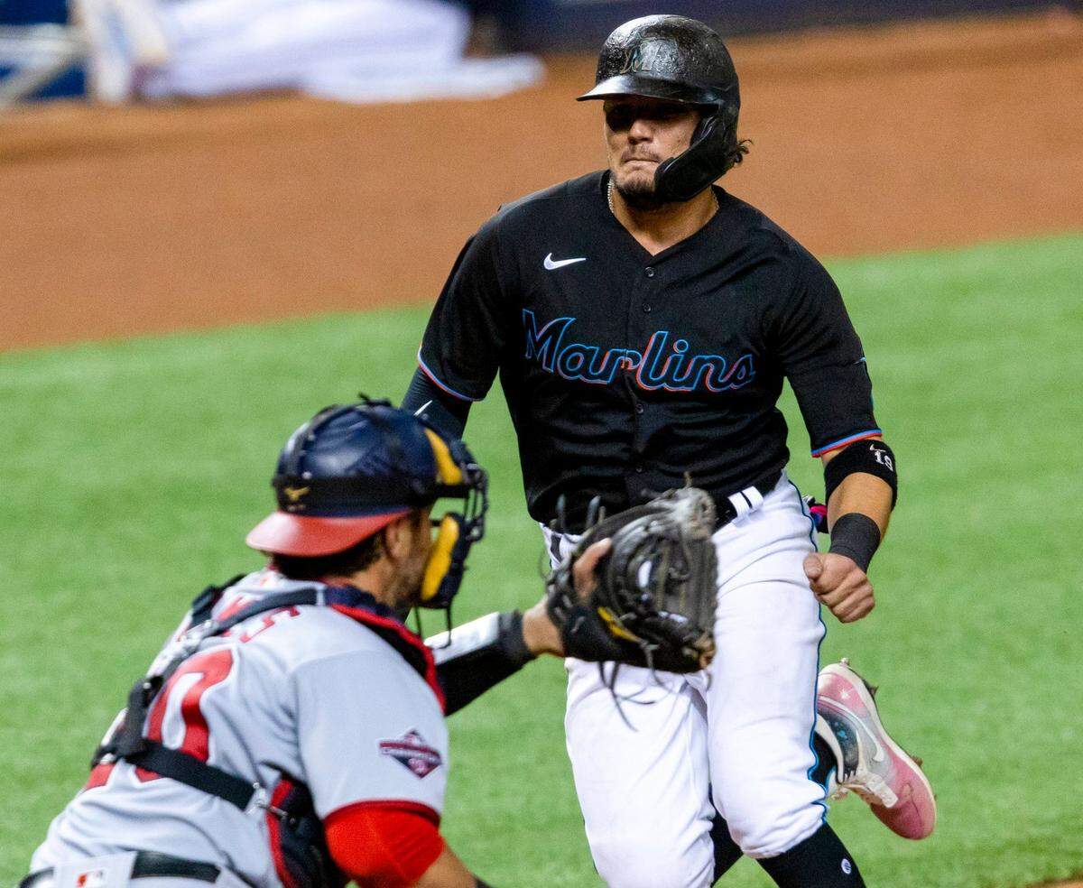 Miami Marlins short stop Miguel Rojas (19) attempts to slide into home plate before being thrown out in the sixth inning of a Major League Baseball game against the Washington Nationals at Marlins Park in Miami, Florida on Saturday, September 19, 2020. The Marlins unsuccessfully challenged the play.
