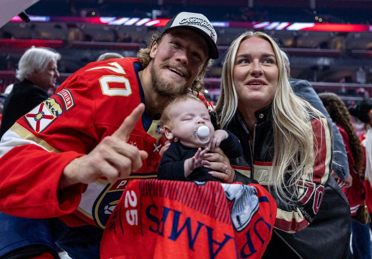 Florida Panthers center Jesper Boqvist (70), left, poses with his family and the Stanley Cup after the Panthers defeated the Edmonton Oilers in Game 6 on Tuesday, June 17, 2025, in Sunrise, Fla.