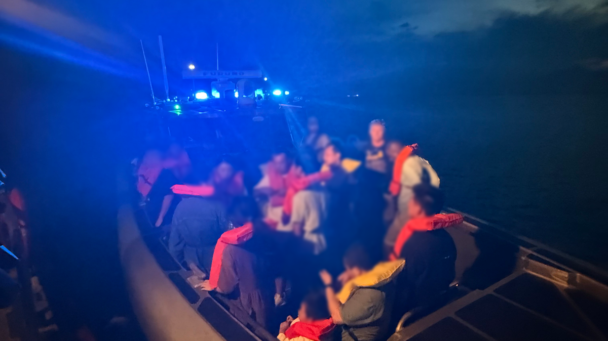 Chinese migrants are boarded onto a U.S. Customs and Border Protection Air and Marine Operations boat Saturday, Aug. 30, 2025, near Fort Pierce Inlet. The people were placed on a Coast Guard cutter and transferred to Bahamian officials.