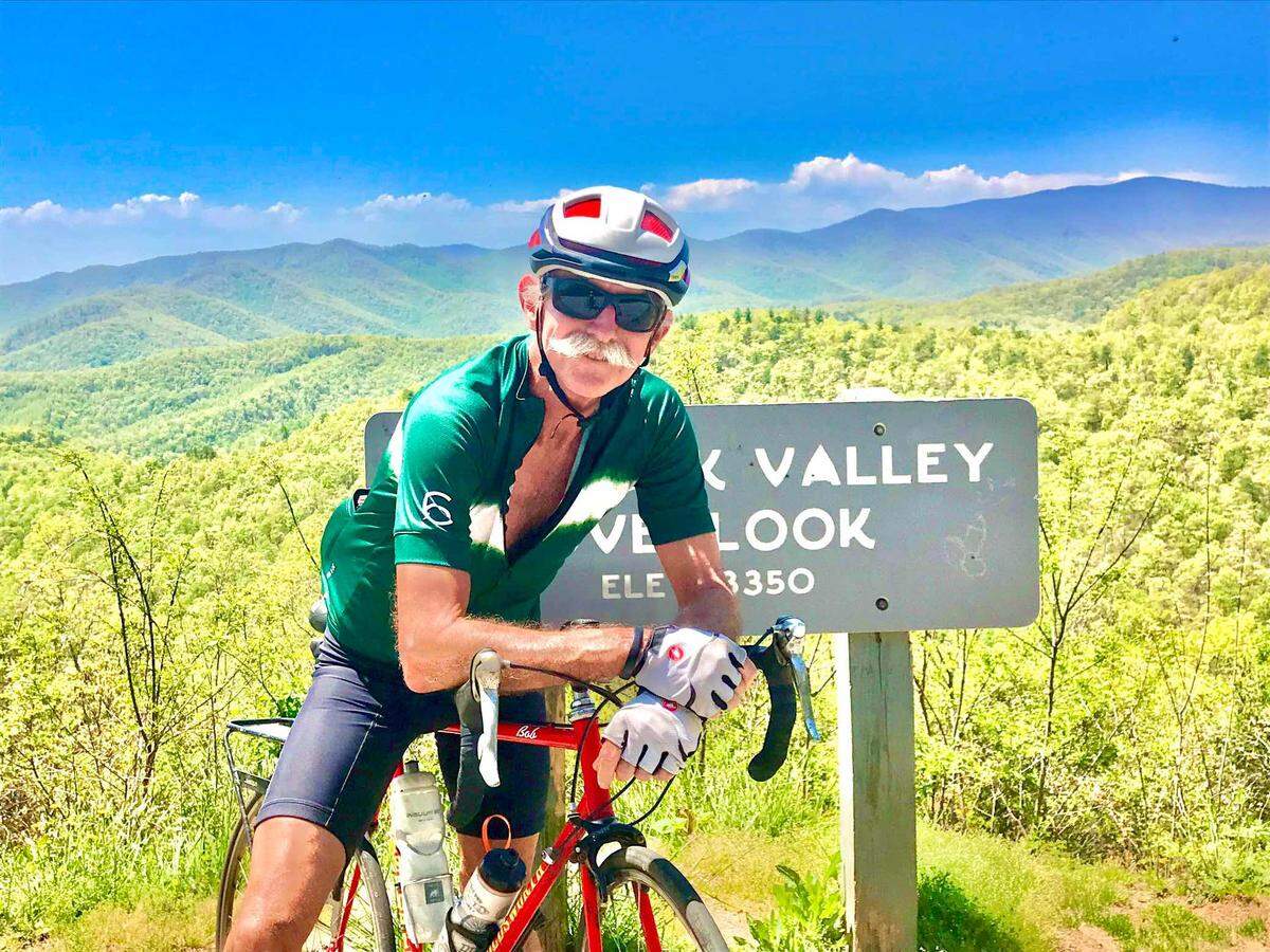 Murry Sill biking in Asheville, North Carolina, at Bad Fork Valley Overlook. Sill and his wife Ricky had a second home in Asheville.