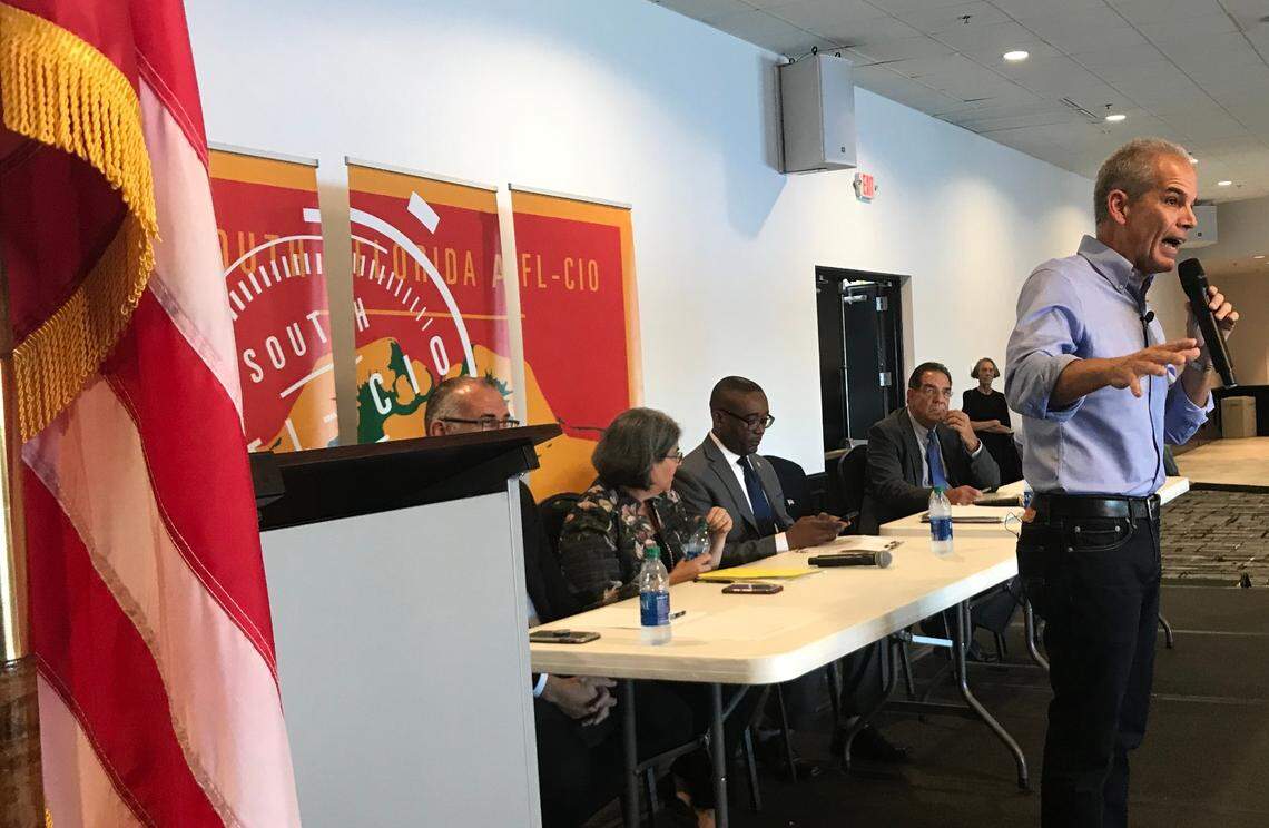 Former county mayor Alex Penelas steps in front of fellow candidates during the first debate of the 2020 race for Miami-Dade mayor. The Oct. 21, 2019, event was held at the Firefighters Memorial union hall in Doral. Pictured behind Penelas are county commissioners Esteban “Steve” Bovo, Daniella Levine Cava, Jean Monestime and Xavier Suarez. Monestime dropped out of the race in April, but the other three commissioners are on the ballot for the Aug. 18 primary in the mayoral race.