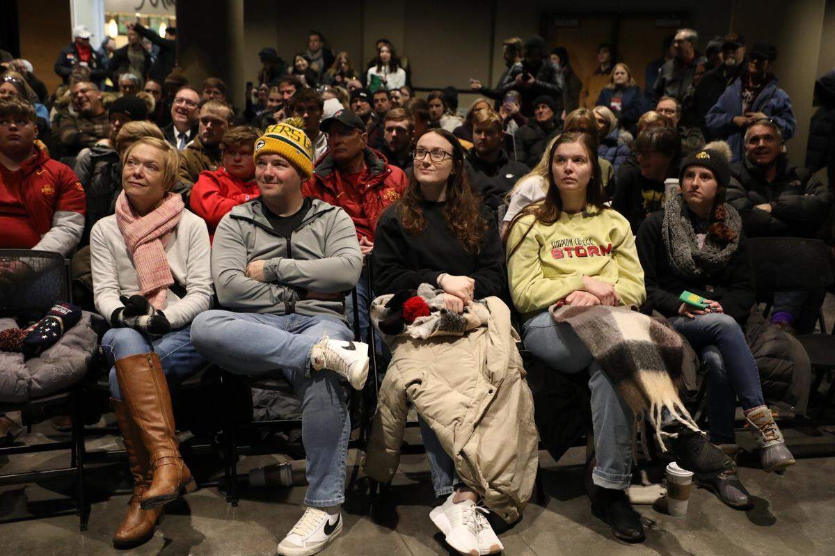 People attend a rally in an overflow room where a live video of former President Donald Trump speaking was displayed on Sunday, Jan 14, 2023, at Simpson College in Indianola, IA, as Republican candidates work to lock down undecided Iowans before Monday’s caucuses.