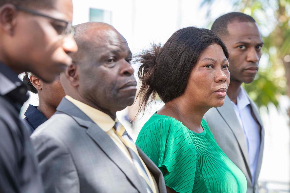 The family of Peniel Janvier, who drowned at a city pool a few weeks ago, appears during a press conference on Friday, Sept. 2, 2022, outside the Scott Rakow Youth Center in Miami Beach to demand answers about how he died. From left: Jonathan Janvier, brother, Lumanne Janvier, father, Nicole Mathurin, mother, and brother Daniel Janvier.