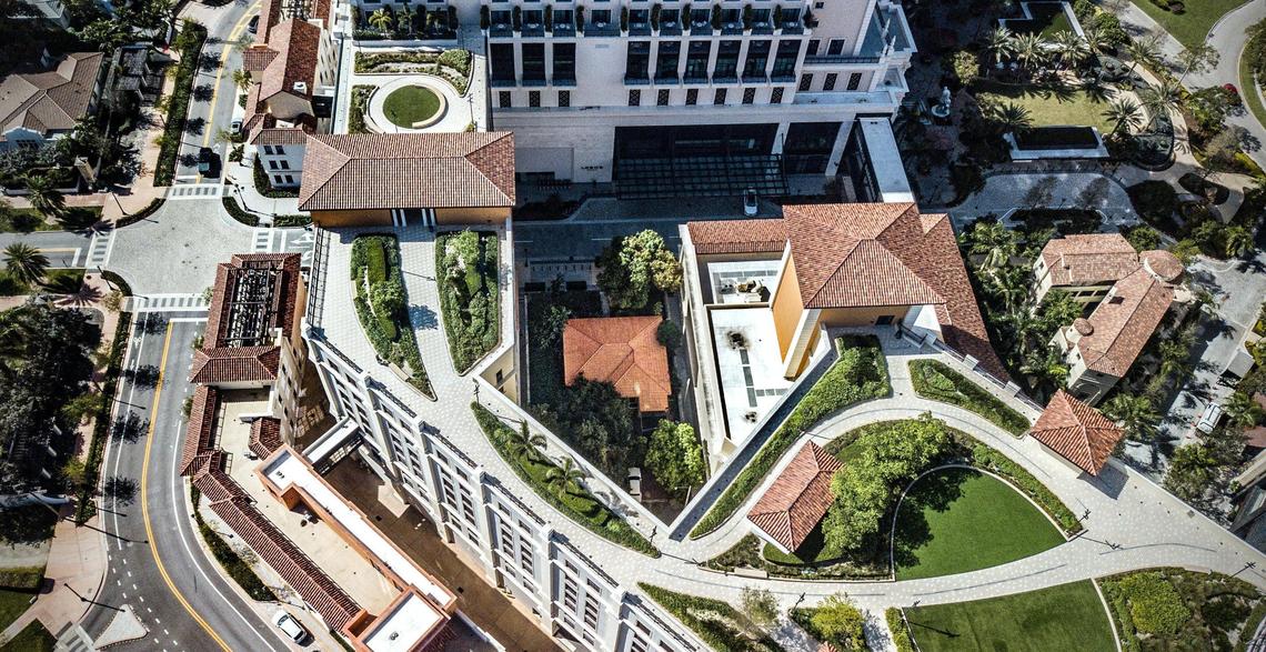 At the center is Orlando Capote’s single-family home that was once inside a residential neighborhood. After the city rezoned the area, the house is the last one standing and is now surrounded by The Plaza development, which includes luxury condos and the Loews Hotel, in Coral Gables, FL on Wednesday, Feb. 7, 2024.