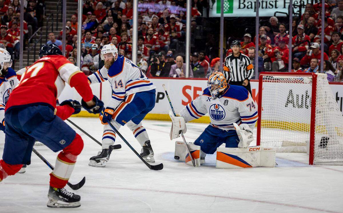 Edmonton Oilers goaltender Stuart Skinner (74) makes a save during the first period of Game 4 in the NHL Stanley Cup Final series at Amerant Bank Arena on Thursday, June 12, 2025, in Sunrise, Fla.
