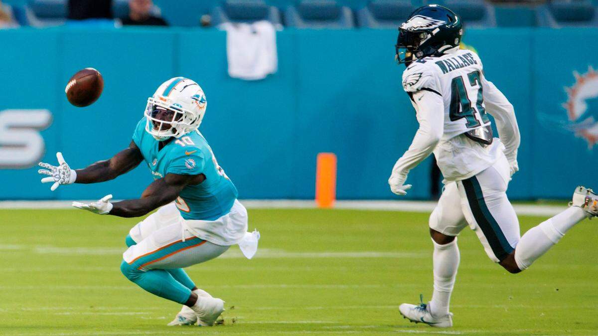 Miami Dolphins wide receiver Tyreek Hill (10) catches a pass against Philadelphia Eagles safety K’Von Wallace (42) during first quarter of an NFL preseason football game at Hard Rock Stadium on Saturday, August 27, 2022 in Miami Gardens, Florida.