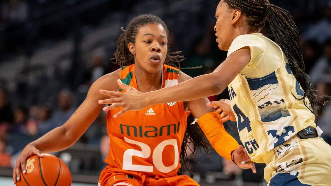Miami Hurricanes guard Kelsey Marshall dribbles past a Georgia Tech defender as UM beat the 16th-ranked Yellow Jackets 51-39 in Atlanta on Feb. 20, 2022.