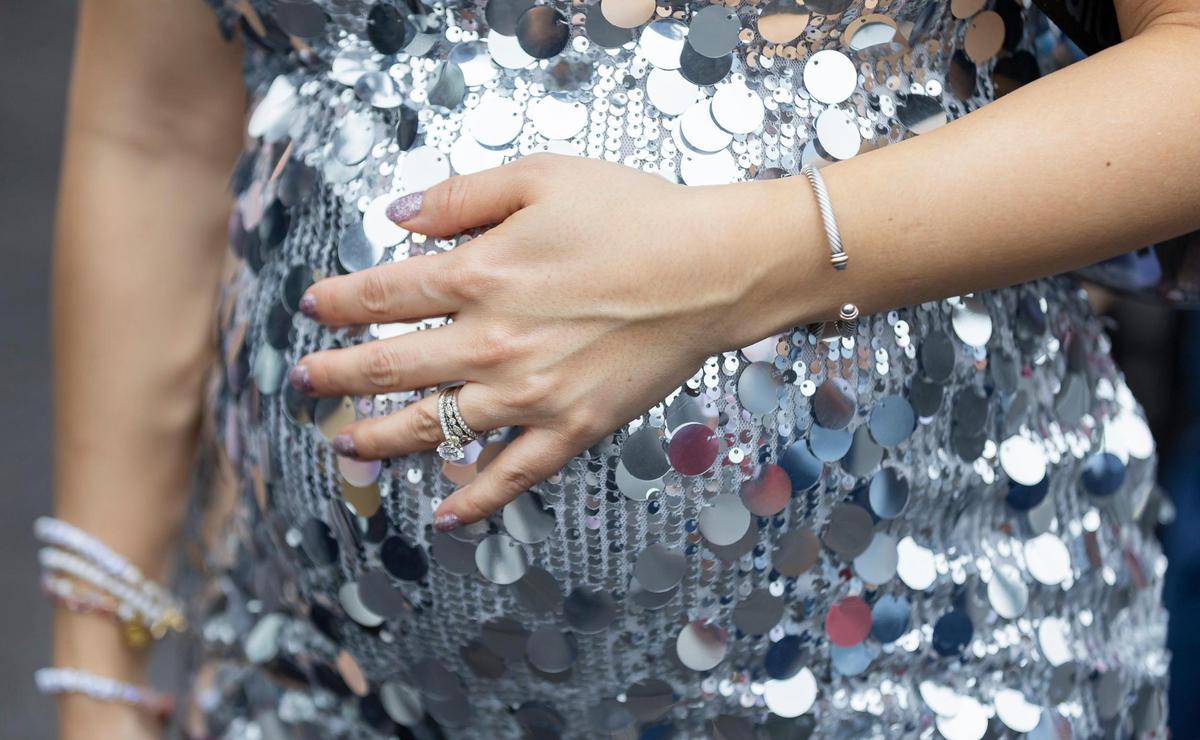 Paola Werner, from Ann Harbor, Michigan, takes her unborn child to Hard Rock Stadium to watch Taylor Swift’s The Eras Tour on Friday, Oct.18, 2024, in Miami Gardens, Fla.