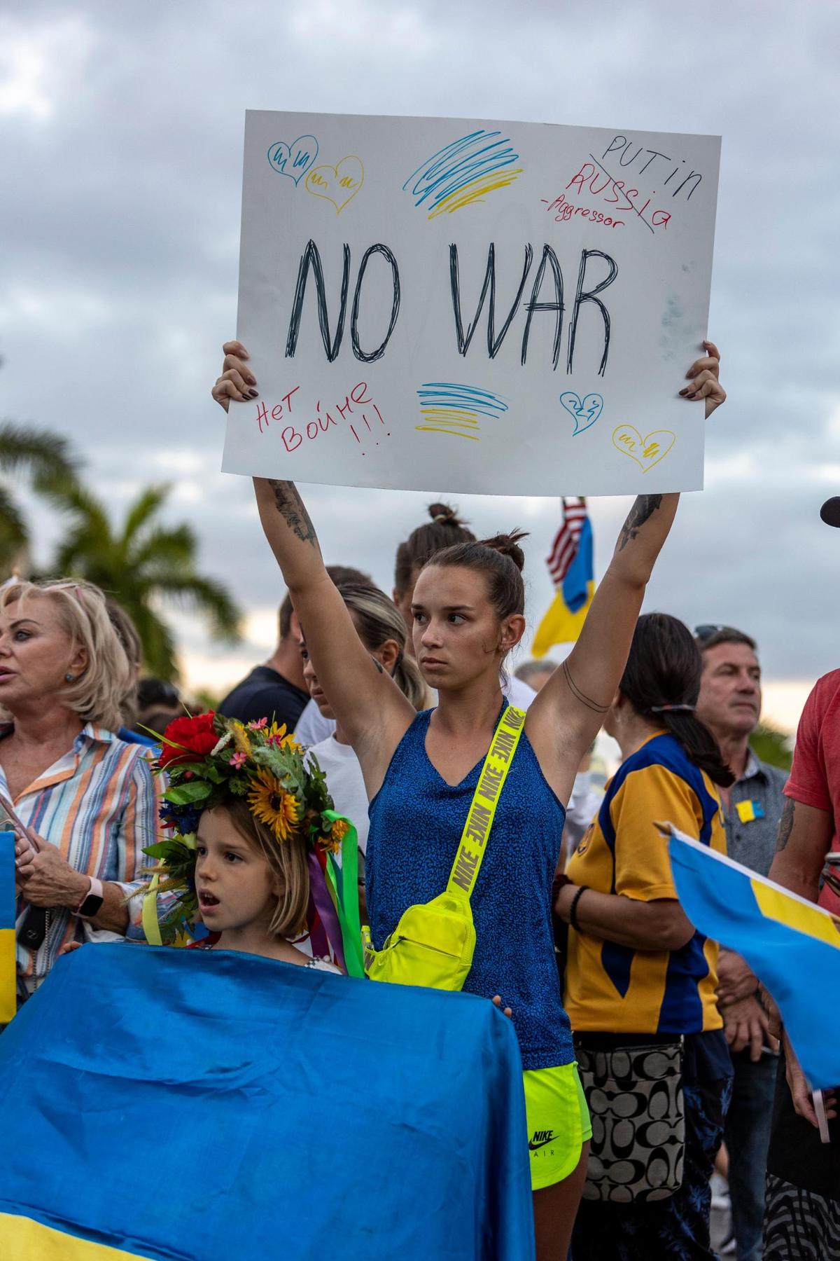 Alena Yurchenco, who is originally from Russia, holds a ‘No War’ sign during a demonstration in front of Hallandale Beach City Hall on Feb. 24, 2022. Members of the Ukrainian and Russian communities in South Florida gathered there in support of Ukraine after Russian forces invaded the country earlier in the day.