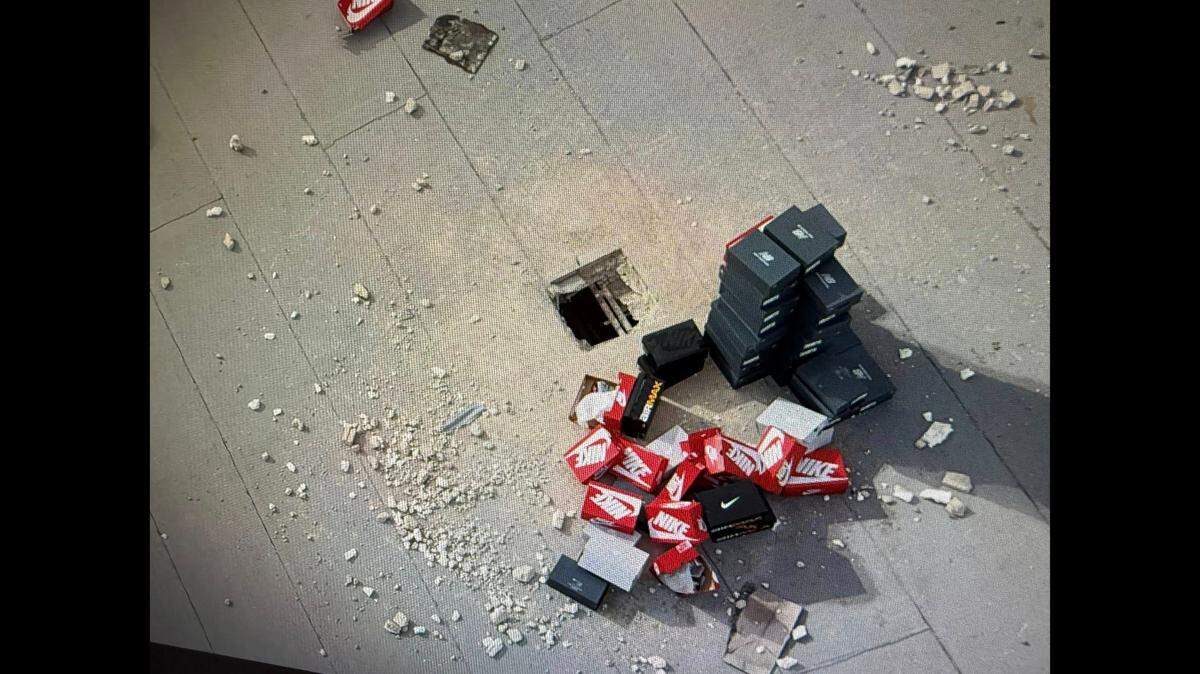 The thieves got away with as many as 400 pairs of shoes, but left about 100 pairs on the roof, officials say. It’s suspected they were frightened away.