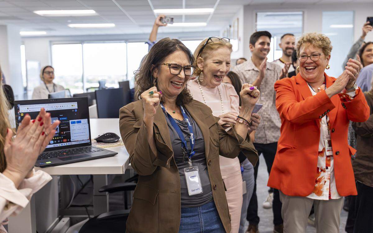 From left to right: Miami Herald reporter Brittany Wallman celebrates after being named a finalist in the Local Reporting Pulitzer Prize category at the Miami Herald, el Nuevo Herald on Monday, May 4, 2026, in Miami, Fla. Her reporting, along with a team from the Miami Herald and WLRN, focused on the deaths attributed to the Brightline trains.