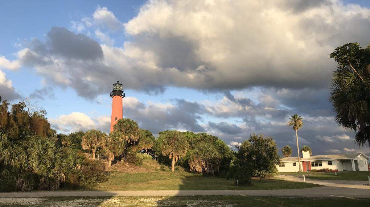 The Jupiter Inlet Lighthouse and surrounding area before sunset.