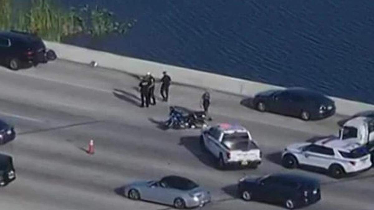 An aerial shot from a CBS 4 Miami helicopter shows police investigate a motorcycle crash on State Road 836 involving two officers Wednesday morning, Jan. 7, 2026.