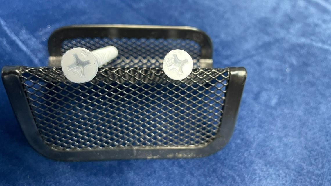 Distinguishing one brand of screw from another is tricky, but Miami-Dade County requires those approved for hurricane-ready installations to carry tiny markings to distinguish them. The screw on the left has a slightly wavy rectangle used by Stanley Black & Decker to mark its Ultracon brand screw. To the right is a screw sold by Manny’s General Fasteners in Hialeah as an Ultracon, despite not being made by Stanley Black & Decker. The Manny’s screw is printed with a square marking. Both screws were provided by American Fasteners Corp.