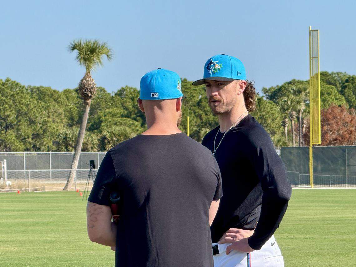 Miami Marlins pitcher Chris Paddack talks with bench coach Carson Vitale at the Marlins Jupiter Academy on Friday, Feb. 13, 2026, in Jupiter, Florida.