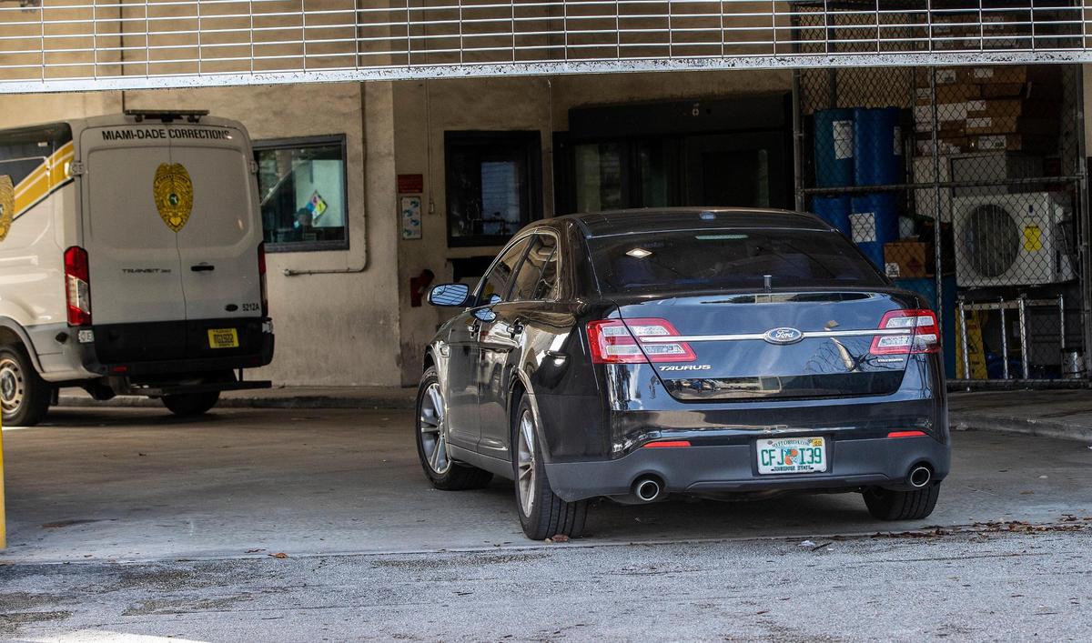 A police car carrying Miami-Dade Commissioner Joe Martinez arrives at the Miami-Dade Turner Guilford Knight Correctional Center in Doral on Tuesday morning, Aug. 30, 2022, as he surrendered to face criminal charges. He is accused of accepting $15,000 in exchange for sponsoring a proposed law five years ago to help a business owner seeking looser county rules.