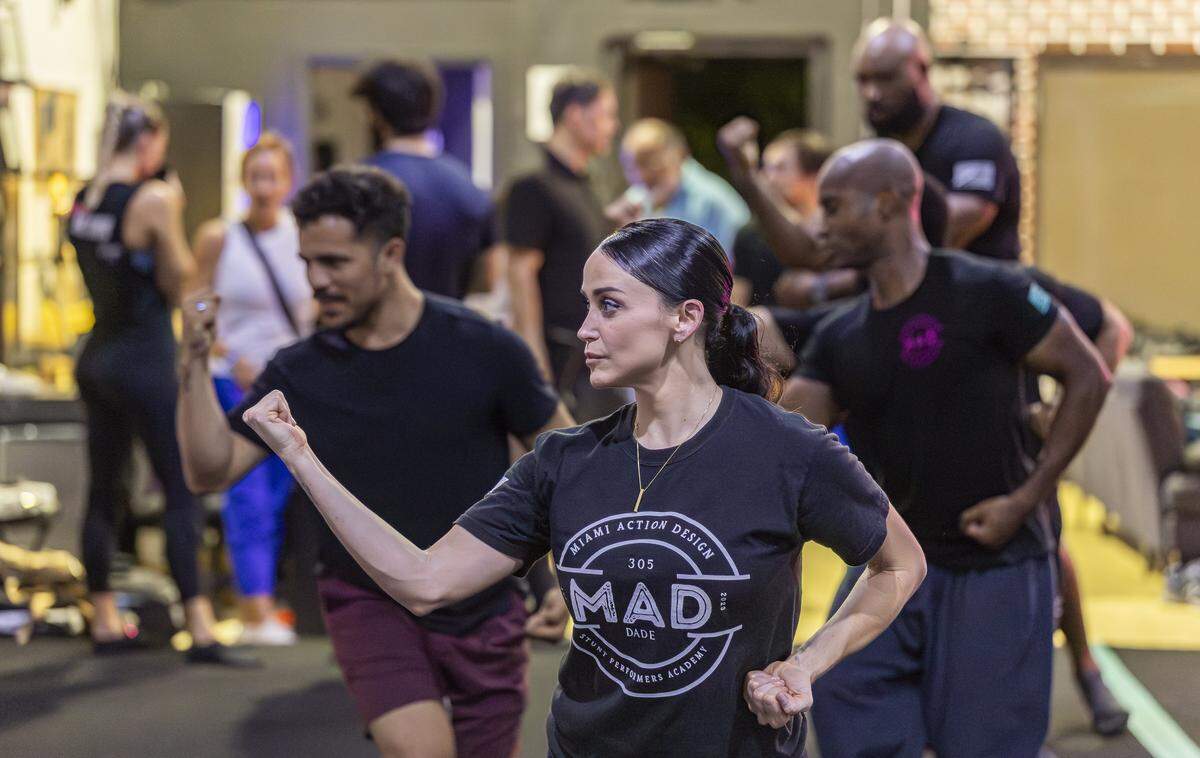 Miami Action Design co-owner Yessenia Cossio, 35, leads members through drills at her gym on Tuesday, Aug. 12, 2025, in Miami, Fla. Miami Action Design is the first stunt gym in Miami-Dade County and offers classes that teach members how to become stunt performers for movies and television.