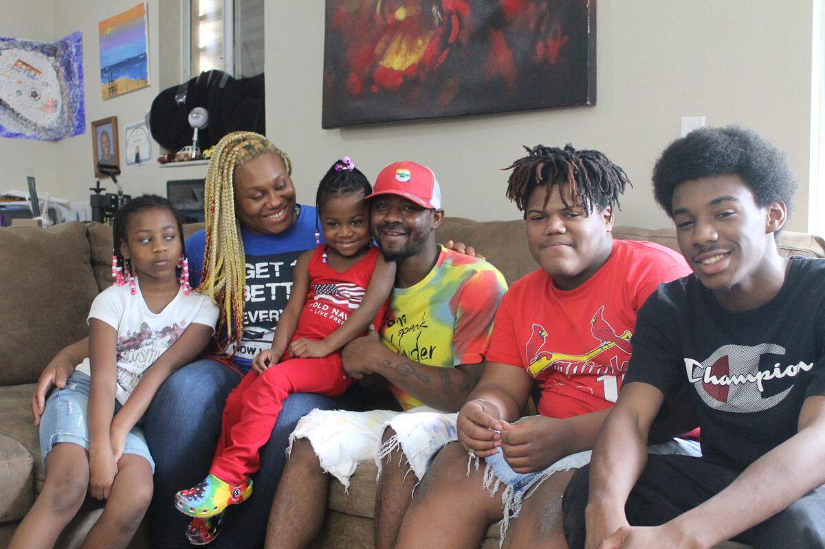 The Toomer family sits on their couch inside their house in Homestead the day before Thanksgiving. Pictured are Celebrity, Tiffany, Serenity, Jermaine, Lennis and Jeremy. Serenity was born with a rare lung condition that requires constant care by her parents and often results in her having to spend months in the hospital.