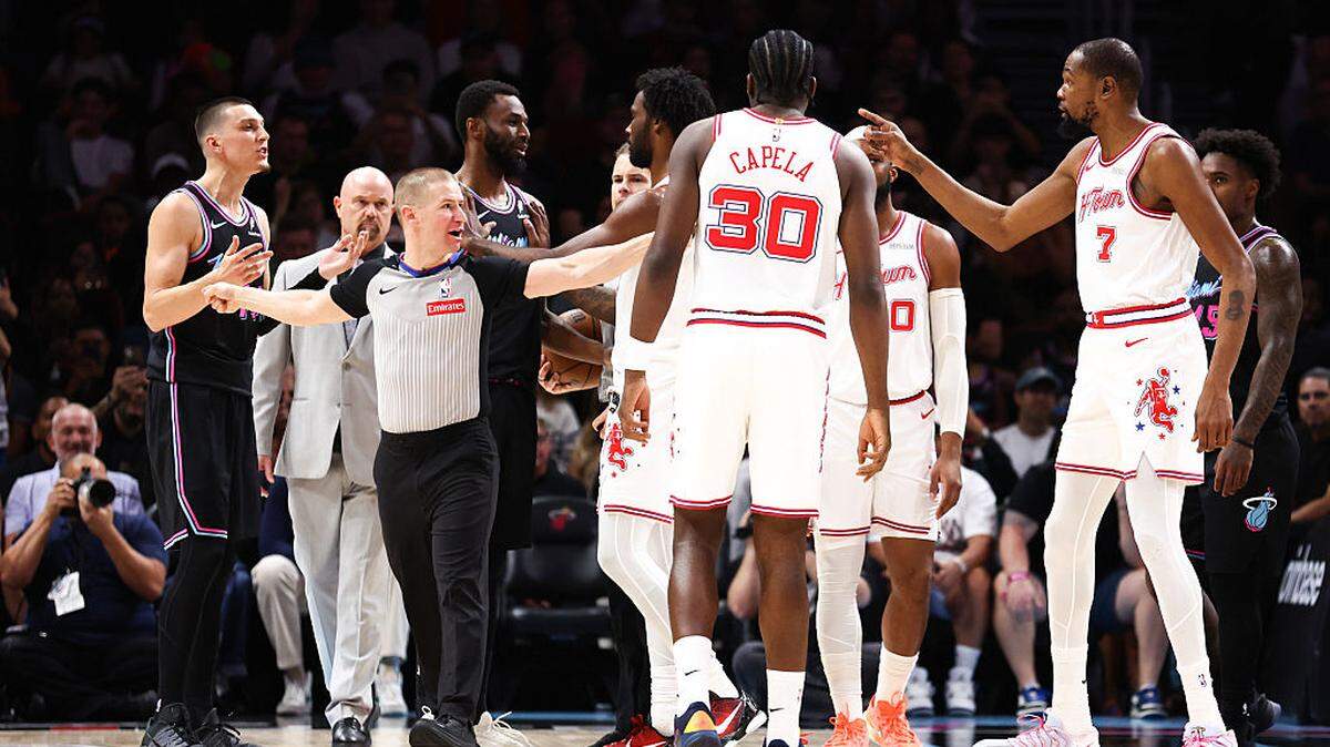 Tyler Herro #14 of the Miami Heat and Kevin Durant #7 of the Houston Rockets exchange words during the first quarter of the game at Kaseya Center on February 28, 2026 in Miami.