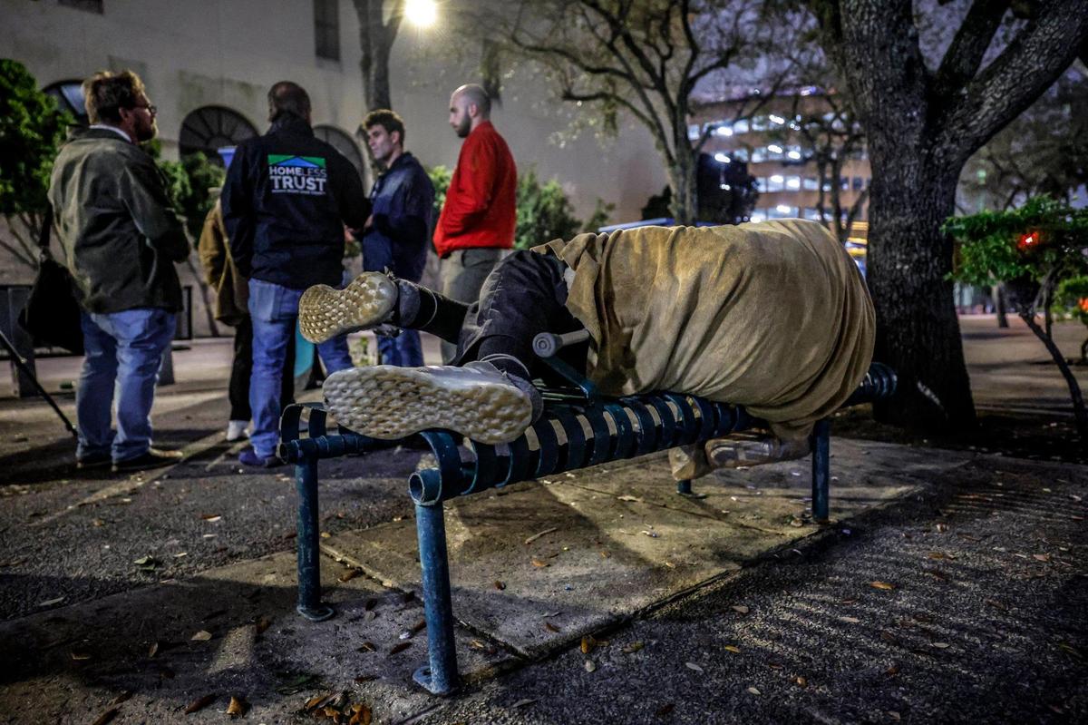 Ron Book, the chair of the Miami-Dade Homeless Trust, walks through downtown city streets with census takers during the Homeless Trust’s biannual homeless census in Miami on Thursday, Jan. 23, 2025.