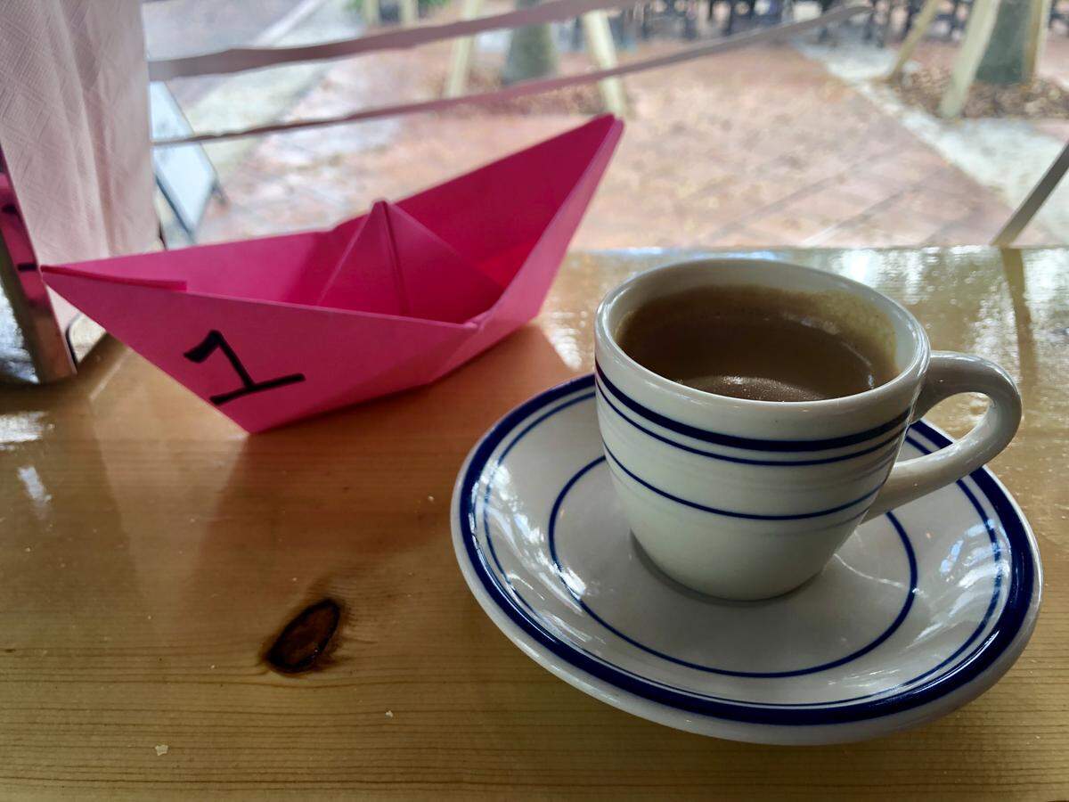 Cuban coffee along with the paper boats that serve as order numbers at Chug’s diner in Coconut Grove.