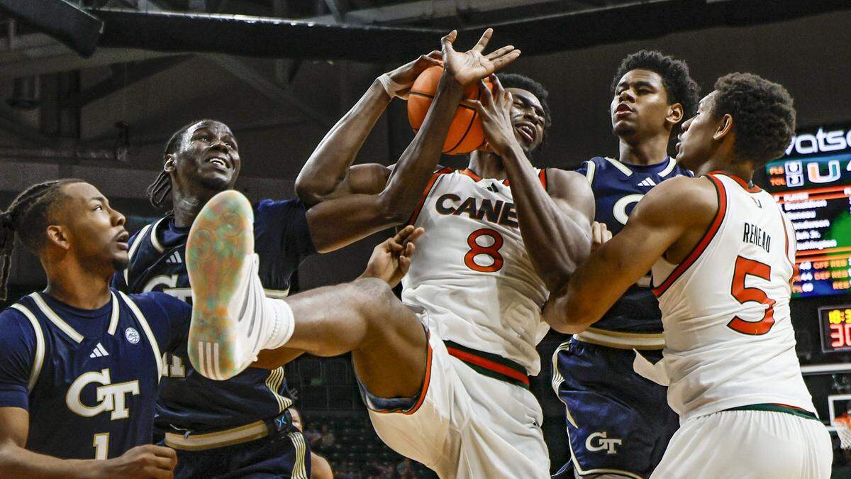 Miami Hurricanes center Ernest Udeh Jr. (8) battles for a rebound during the second half of an NCAA basketball game against the Georgia Tech Yellow Jackets at the Watsco Center on the University of Miami Campus on Saturday, January 10, 2026 in Coral Gables, Florida.