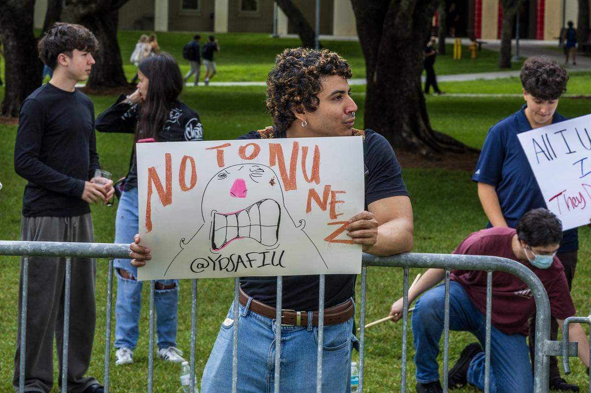 Philosophy/International relations student Michael Andrillon was among a group of people from different campus organizations and several street organizations protested against the university's president Jeanette M. Nuñez, and the association of the campus' police with ICE, in front of the Graham Center at Florida International University, in Miami, on Tuesday, April 07, 2026.