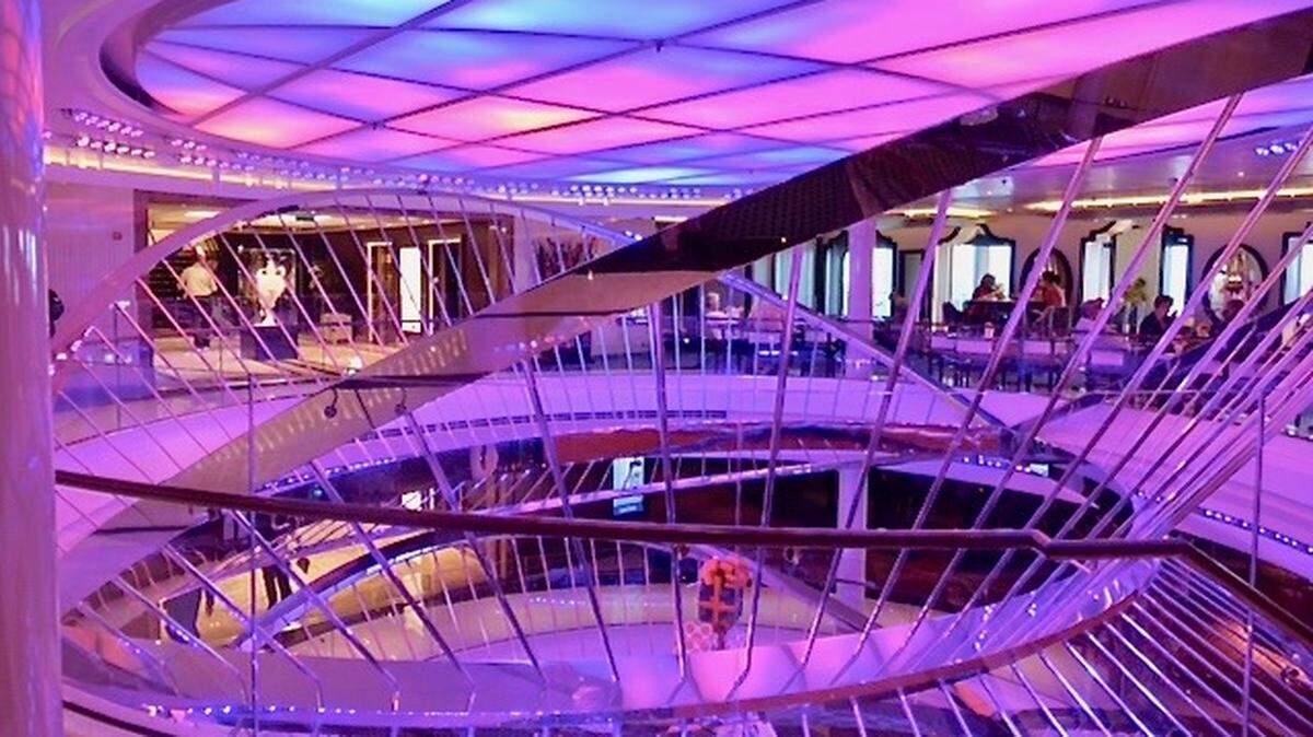 The atrium aboard Holland America’s Nieuw Statendam features a geometric stainless steel sculpture — part of the new ship’s $4.1 million art collection.